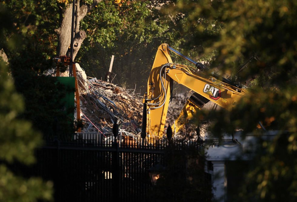 a demolition crew takes apart the facade of the east wing of the white house where u s president donald trump s proposed ballr