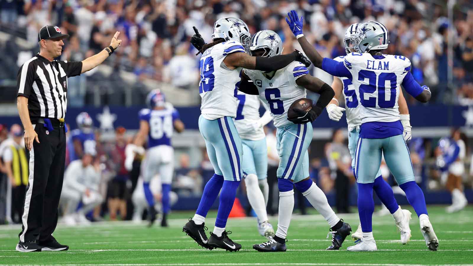dallas cowboys safety donovan wilson 6 celebrates with safety malik hooker 28 after making an interception against the new york giants during overtime at at t stadium