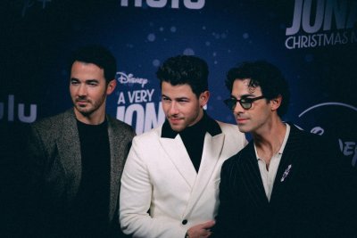 jonas brothers celebrate premiere of christmas movie in nyc