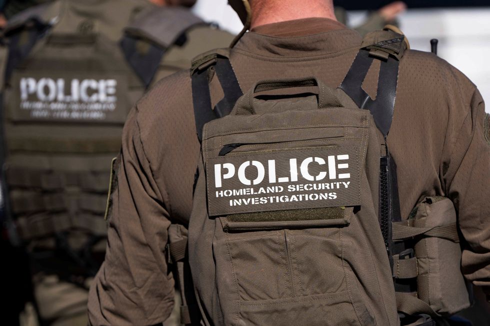 u s immigrations and customs ice homeland security investigations hsi agents take part in the detaining of two documented i