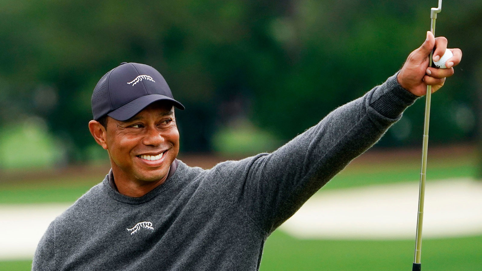 tiger woods is all smiles on the green